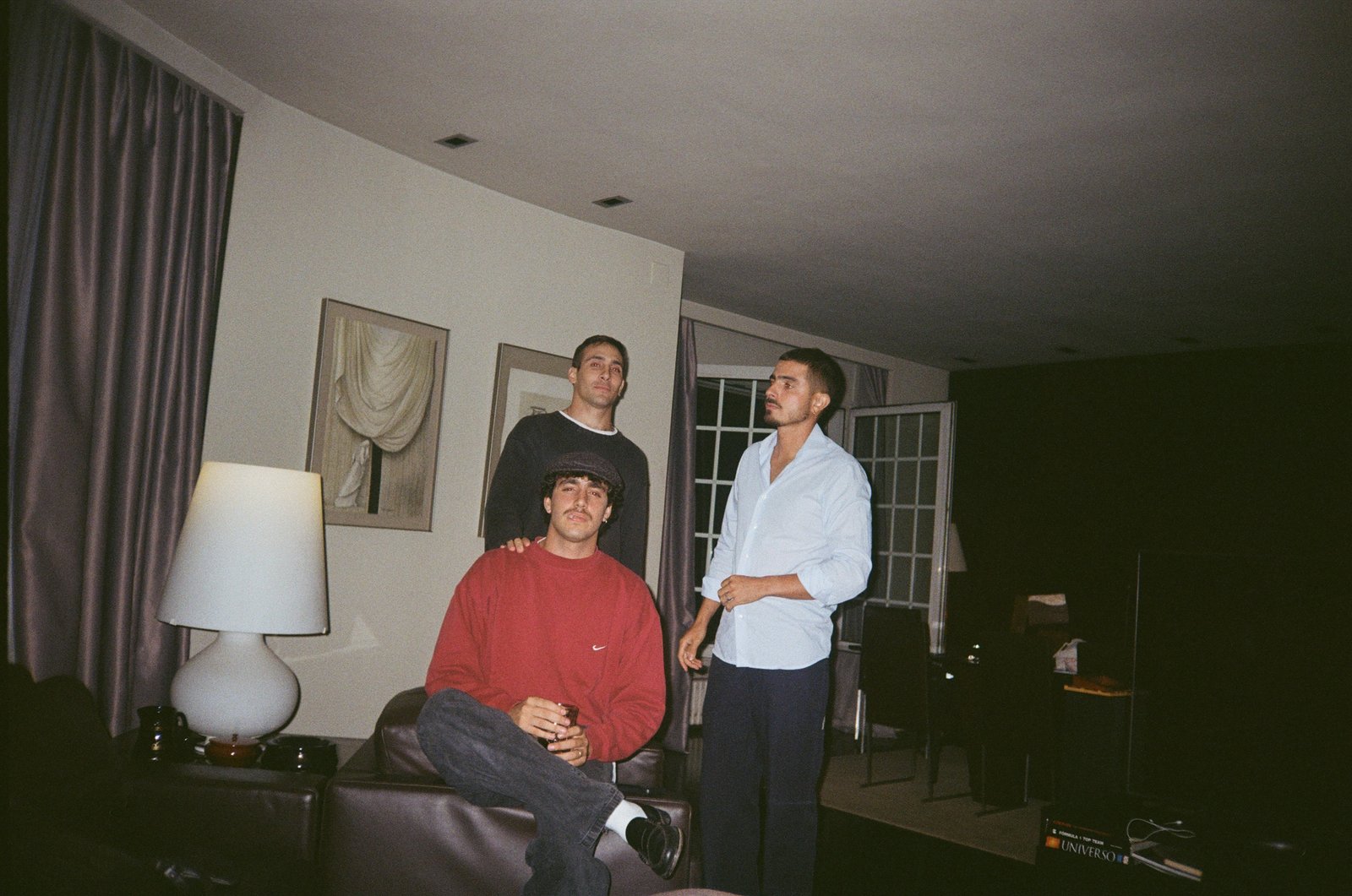 The three members of The Jabba Records, analog flash portrait in a living room