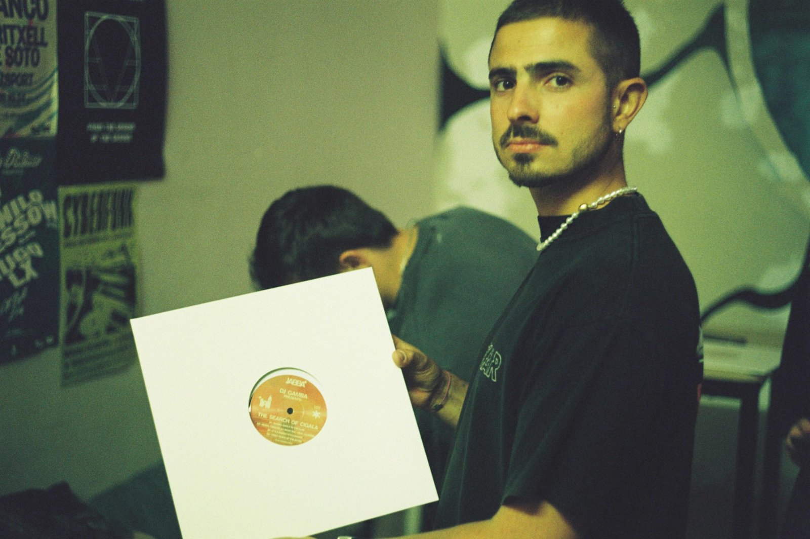 TJR 001 held up in its white sleeve, showing the orange label of The Search of Cigala